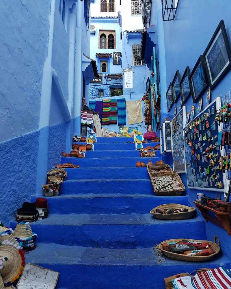 Vibrant blue walls and stone steps of a traditional alley in Chefchaouen Morocco